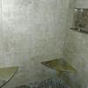 Here we added floating shower seats as well as trimming out the soap-shampoo cubby to dress up the tile shower