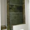 Here we trimmed out the shower opening to match the vanity and tubdeck stone.