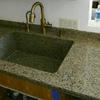 We custom built this sink out of the same stone as the countertop.